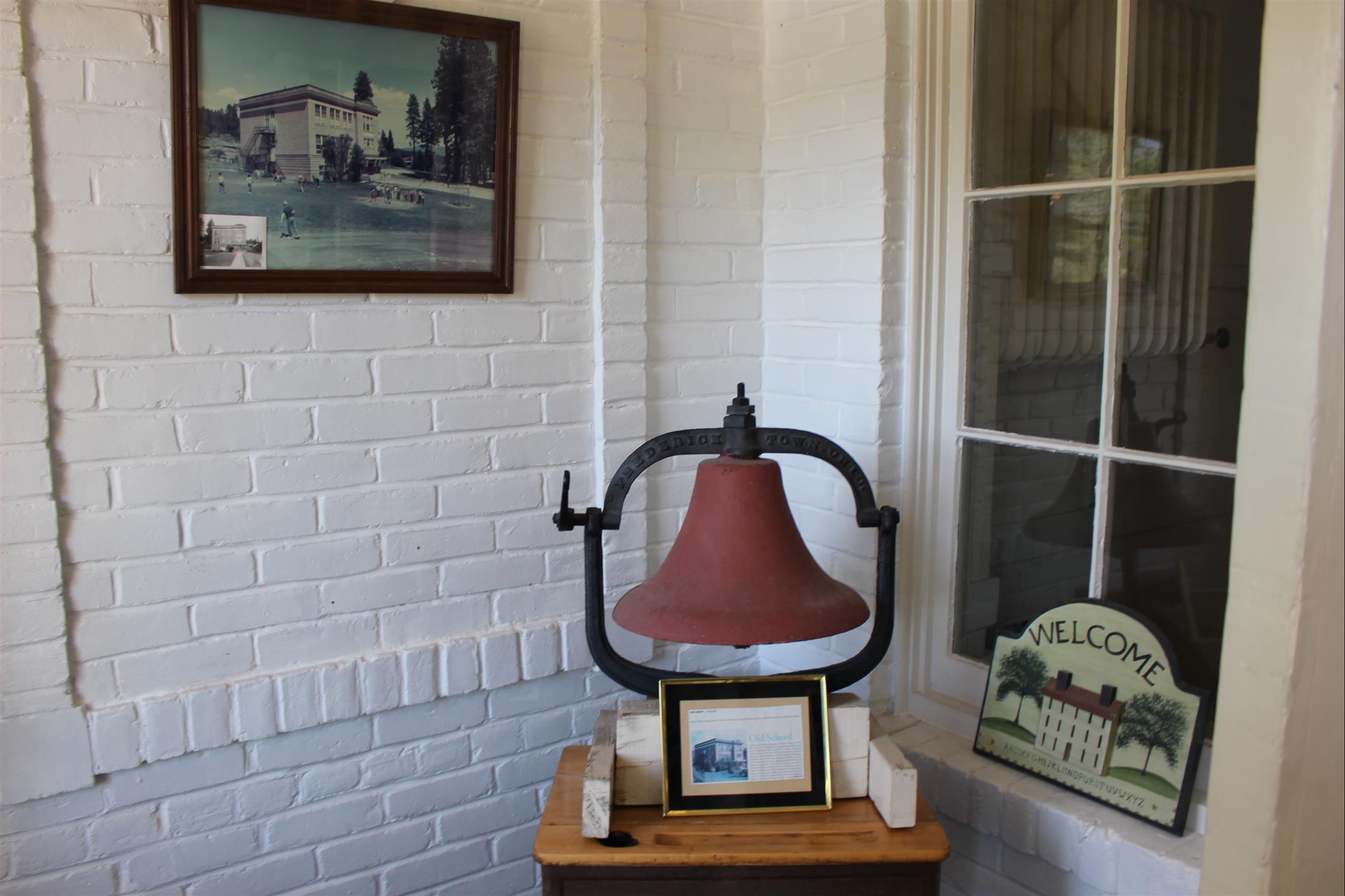 old school bell and photo of school house